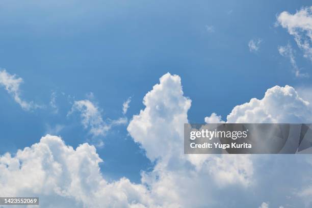 white clouds in a blue sky in summer - 入道雲 ストックフォトと画像