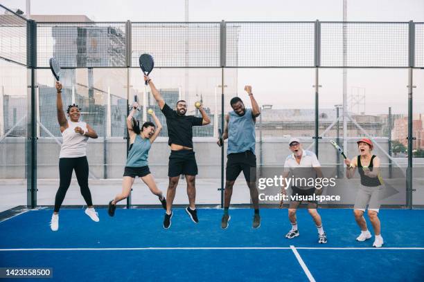 group photo after successful paddle tennis match - using a paddle imagens e fotografias de stock