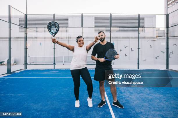 positive friends at paddle tennis court - paddle tennis stock pictures, royalty-free photos & images