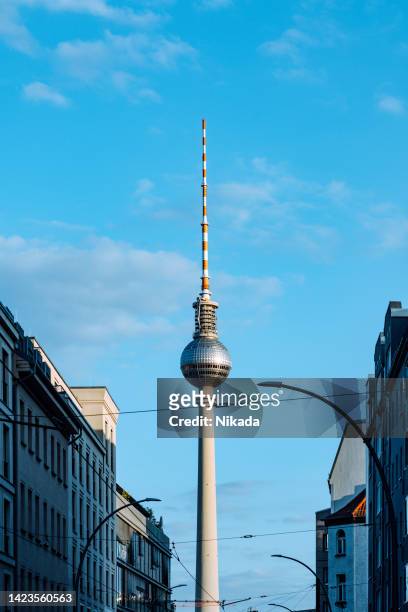 berlin tv tower against blue sky - berlin fernsehturm stock pictures, royalty-free photos & images