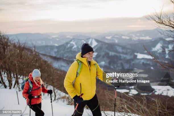 senior couple hiking in winter. - winter sport walk old stock pictures, royalty-free photos & images
