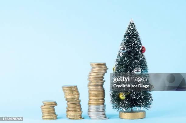 image depicting christmas in times of inflation. - christmas savings stock pictures, royalty-free photos & images