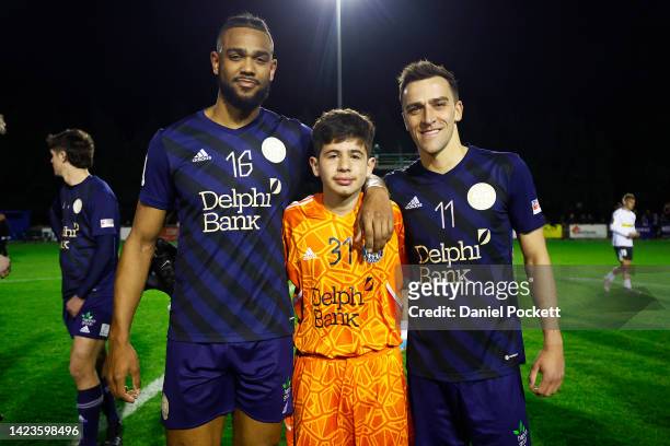 Year old Cannons goalkeeper Ymer Abili poses for a photograph with Nicolas Niagioran of the Cannons and Wade Dekker of the Cannons after the...