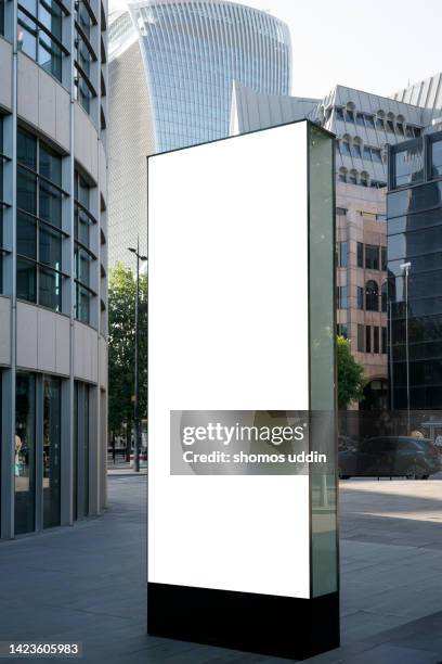 blank advertising billboard in london financial district - vertical billboard stock pictures, royalty-free photos & images