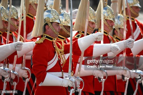 The Life Guard dismounted detachment of the Household Cavalry are seen entering the gates of Buckingham Palace ahead of the procession for the...