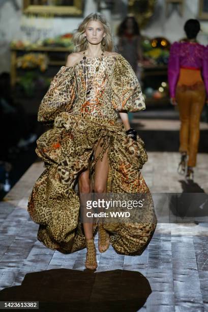 Model walks down the runway at the Spring 2005 Roberto Cavalli show in Milan.