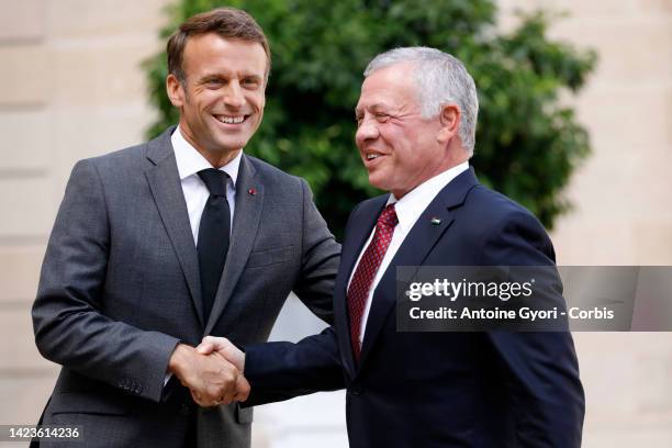 French President Emmanuel Macron welcomes King Abdullah II of Jordan prior to a lunch at the Elysee Presidential Palace on September 14, 2022 in...