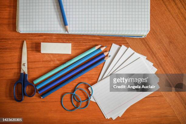 school supply still life with blue pencils - angela auclair stock pictures, royalty-free photos & images