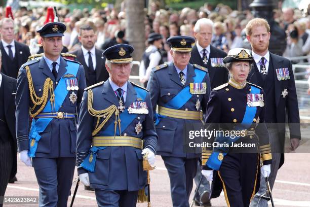 Prince William, Prince of Wales, King Charles III, Prince Richard, Duke of Gloucester, Anne, Princess Royal and Prince Harry, Duke of Sussex walk...