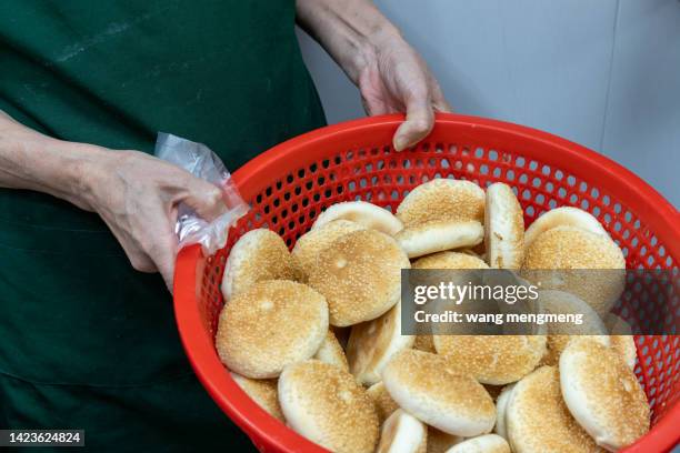 a man carrying a basket of cakes - gourmet gift basket fotografías e imágenes de stock