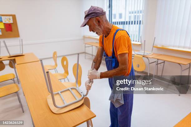 fixing the frame of the school chair - school caretaker stock pictures, royalty-free photos & images