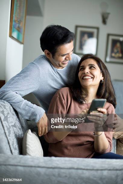 loving couple spending leisure time at home - daily life in india stock pictures, royalty-free photos & images