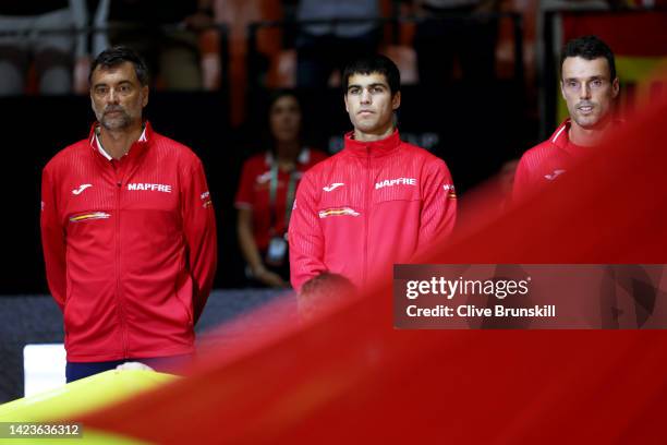 New men's world number one Carlos Alcaraz of Spain lines up with his Spanish team captain Sergi Bruguera and team mate Roberto Bautista Agut of Spain...