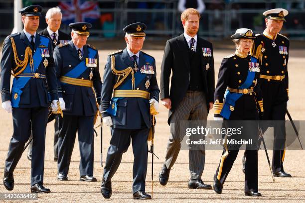 Prince William, Prince of Wales, King Charles III, Prince Harry, Duke of Sussex, Anne, Princess Royal and Sir Timothy Laurence walk behind the coffin...
