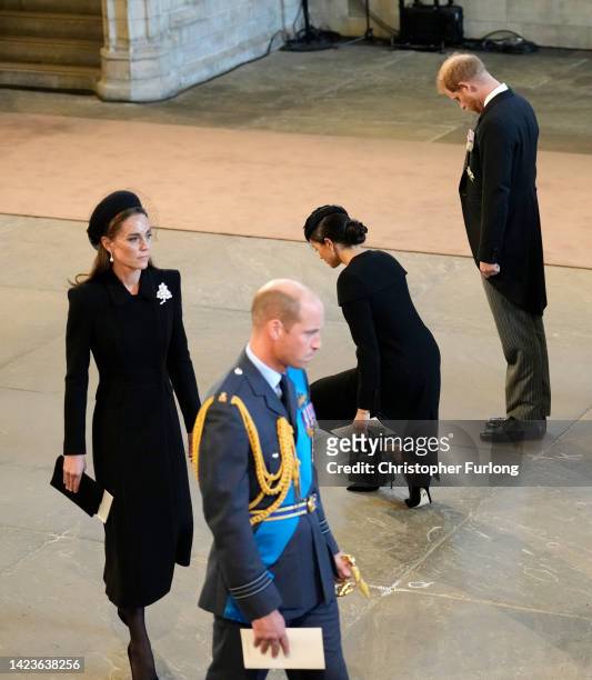 Catherine, Princess of Wales, Prince William, Prince of Wales, Meghan, Duchess of Sussex and Prince Harry, Duke of Sussex pay their respects in The...