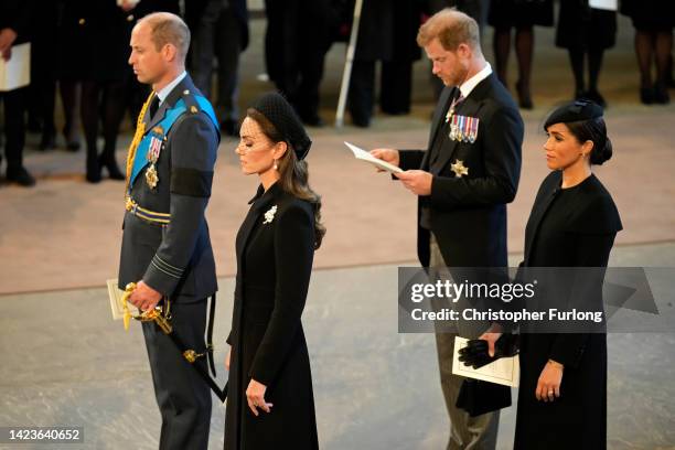 Prince William, Prince of Wales, Catherine, Princess of Wales, Prince Harry, Duke of Sussex and Meghan, Duchess of Sussex seen inside the Palace of...