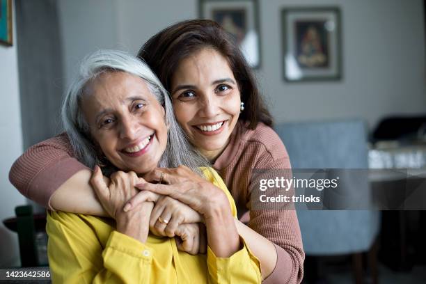 happy woman with mother - aging happy stockfoto's en -beelden