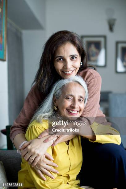 happy woman with mother - aging happy stockfoto's en -beelden