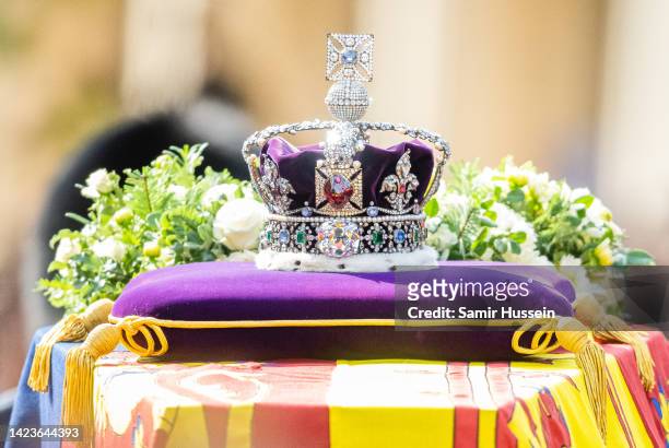 Queen Elizabeth II's coffin, adorned with a Royal Standard and the Imperial State Crown is taken in procession on a Gun Carriage of The King's Troop...