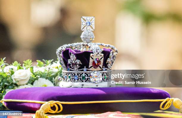 Queen Elizabeth II's coffin, adorned with a Royal Standard and the Imperial State Crown is taken in procession on a Gun Carriage of The King's Troop...