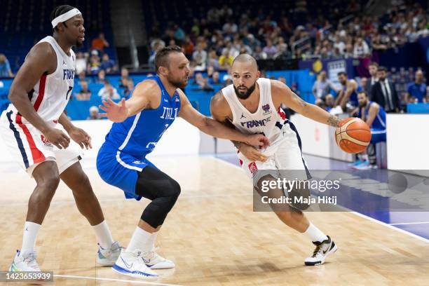 Evan Fournier of France battles with Stefano Tonut of Italy during the FIBA EuroBasket 2022 quarterfinal match between France v Italy at EuroBasket...