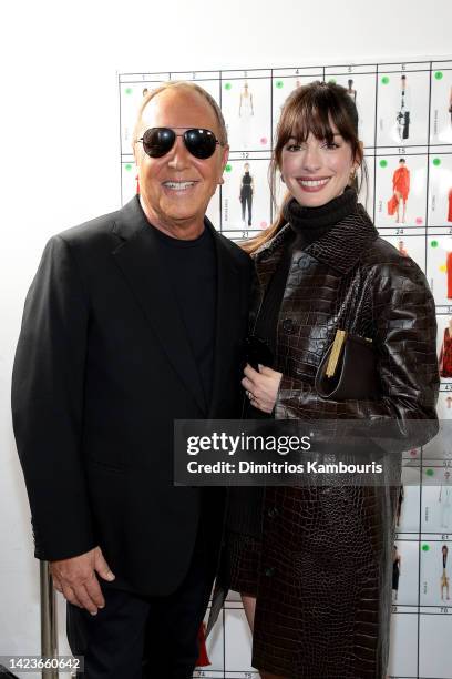 Michael Kors and Anne Hathaway pose backstage during the Michael Kors Collection Spring/Summer 2023 Runway Show on September 14, 2022 in New York...