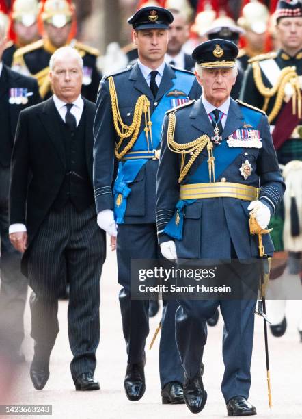 David Armstrong-Jones, Earl of Snowdon, King Charles III and Prince William, Prince of Wales walk behind Queen Elizabeth II's coffin as it is taken...