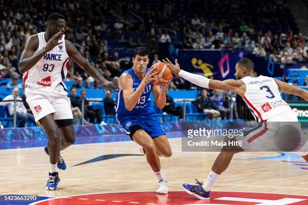 Simone Fontecchio of Italy in action against Timothé Luwawu-Cabarrot and Moustapha Fall of France during the FIBA EuroBasket 2022 quarterfinal match...