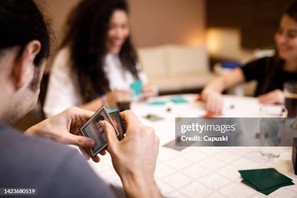 group of friends having fun while playing role-playing games - brädspel bildbanksfoton och bilder