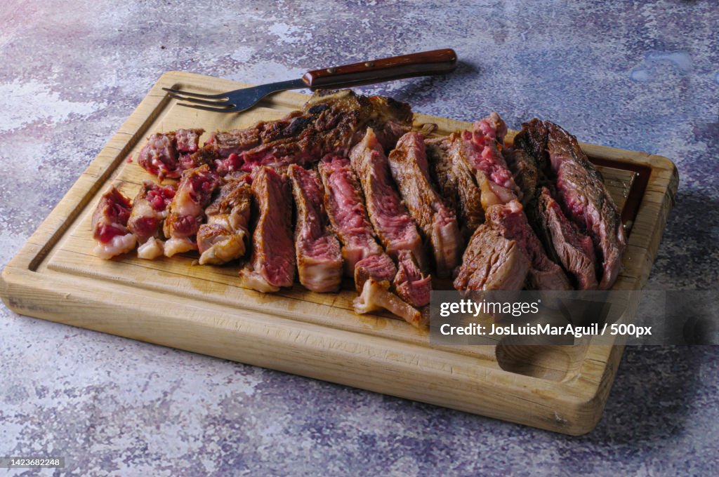 High angle view of meat on cutting board