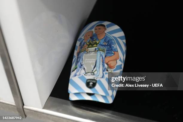 Detailed view of the shin pads of Phil Foden of Manchester City inside the dressing room prior to the UEFA Champions League group G match between...