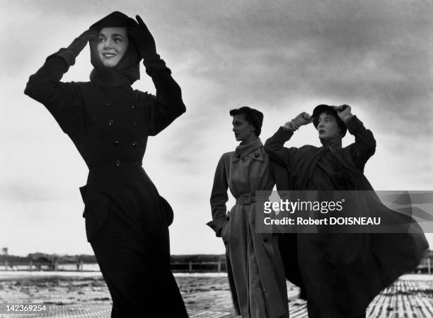 The Famous model Bettina and two other models during a windy fashion shoot for Vogue magazine in September 1949, Robert Doisneau had been working for...