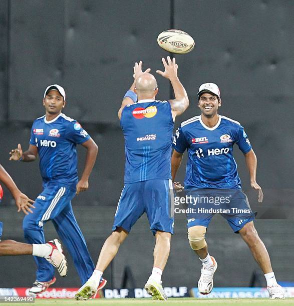 Mumbai Indians players play a game of Rugby during net practice at M.A Chidambaram Stadium on April 2, 2012 in Chennai, India. The inaugural match of...