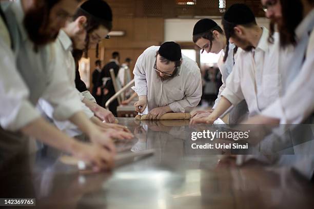 Ultra-Orthodox Jewish men prepare the Matzoth or unleavened bread on April 3, 2012 in Bnei Brak, Israel. Religious Jews throughout the world eat...