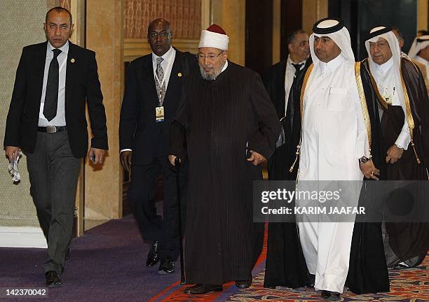 Sheikh Yusuf al-Qaradawi arrives at the opening of the International Conference on Jerusalem in Doha on February 26, 2012. Qatar called for the...