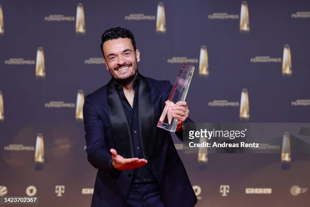Giovanni Zarrella poses with the "Beste Moderation/Einzelleistung Unterhaltung" award during the German Television Award at MMC Studios on September...