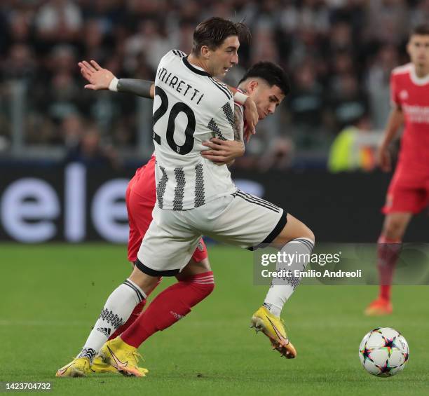 Fabio Miretti of Juventus competes for the ball with Enzo Fernandez of SL Benfica during the UEFA Champions League group H match between Juventus and...