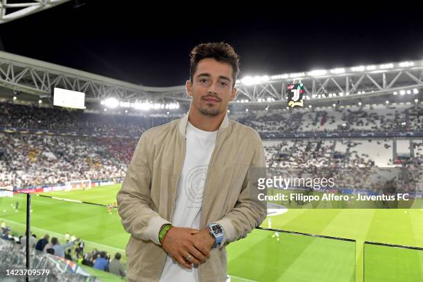 Formula 1 driver Charles Leclerc poses at the stadium prior to the UEFA Champions League group H match between Juventus and SL Benfica at Allianz...