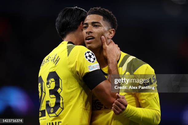 Jude Bellingham of Borussia Dortmund celebrates with team mate Emre Can after scoring their sides first goal during the UEFA Champions League group G...