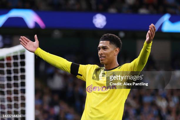 Jude Bellingham of Borussia Dortmund celebrates after scoring their sides first goal during the UEFA Champions League group G match between...