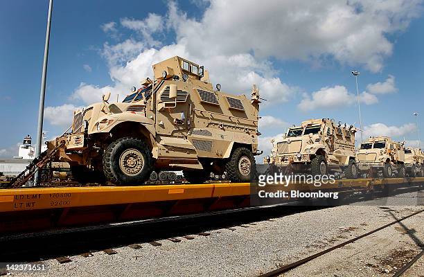 Row of U.S. Military MaxxPro Mine Resistant Ambush Protected fighting vehicles sit on display at the Port of Beaumont upon return from deployment...
