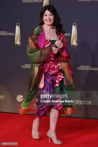 Iris Berben poses with the "Beste Doku-Serie" award during the German Television Award at MMC Studios on September 14, 2022 in Cologne, Germany.