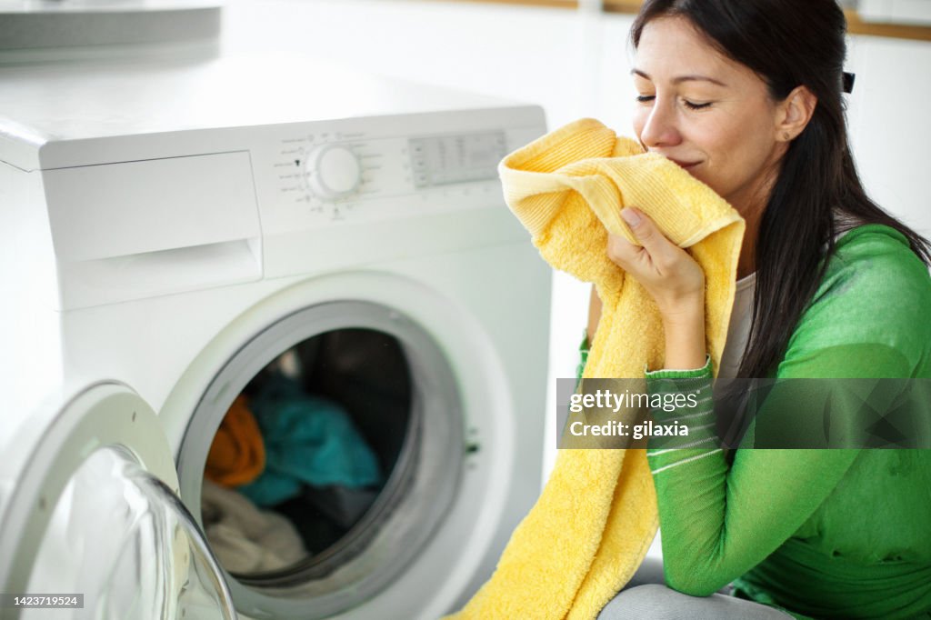 Doing laundry at home.