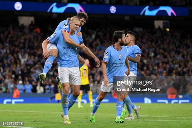 Erling Haaland of Manchester City celebrates with team mate John Stones after scoring their sides second goal during the UEFA Champions League group...