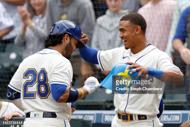 Eugenio Suarez and Julio Rodriguez of the Seattle Mariners celebrate Suarez's home run during the first inning against the San Diego Padres at...