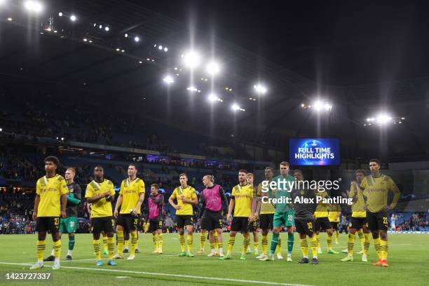 Players of Borussia Dortmund look dejected while acknowledging fans after the UEFA Champions League group G match between Manchester City and...