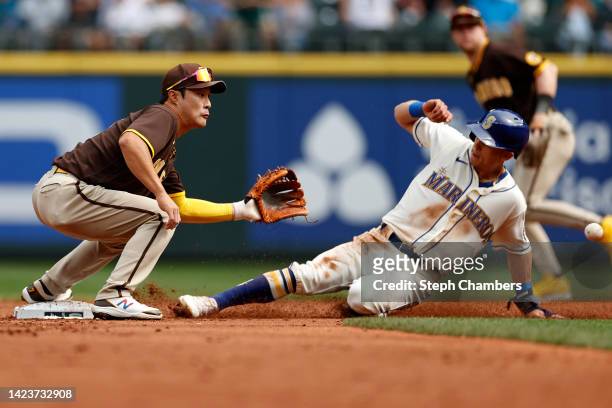 Sam Haggerty of the Seattle Mariners steals second base against Ha-Seong Kim of the San Diego Padres during the second inning at T-Mobile Park on...