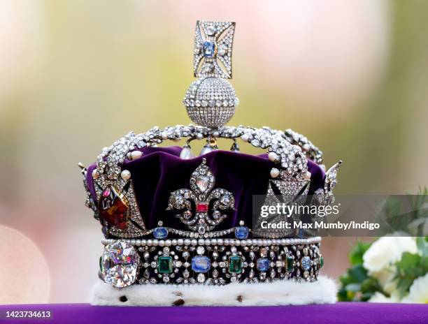 The Imperial State Crown sits on top of Queen Elizabeth II's coffin as it is transported on a gun carriage from Buckingham Palace to The Palace of...