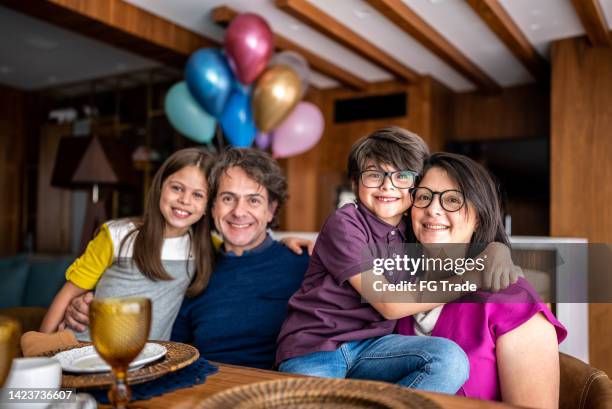 Portrait Of A Family On Dining Table At Home High-Res Stock Photo ...