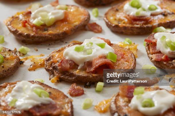 loaded potato slices - stuffed potato stock pictures, royalty-free photos & images